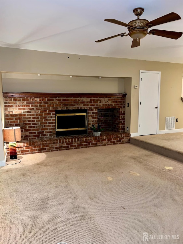 37 Albury Way N, Brunswick, NJ 08902 - unfurnished living room featuring a brick fireplace, carpet floors, brick wall, and ceiling fan