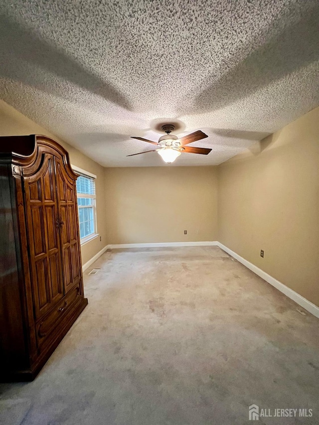 37 Albury Way N, Brunswick, NJ 08902 - carpeted spare room featuring a textured ceiling and a ceiling fan
