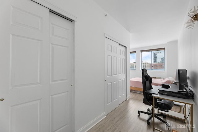 home office with wood finished floors