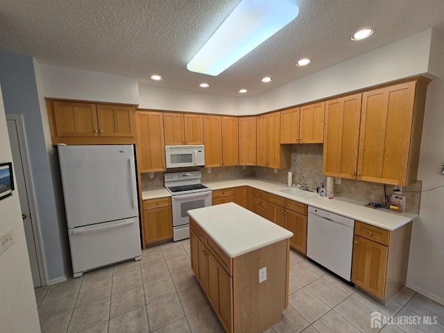 16 Phillip Ct, Monroe, NJ 08831 - kitchen featuring white appliances, a sink, decorative backsplash, a textured ceiling, and light tile patterned floors