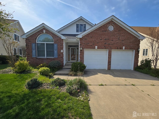 16 Phillip Ct, Monroe, NJ 08831 - traditional home with brick siding, driveway, an attached garage, and a front yard