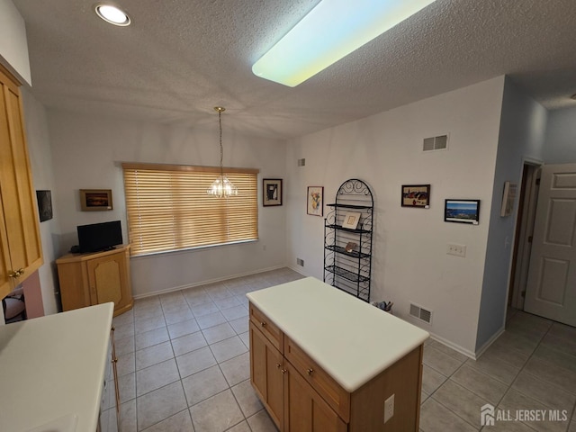 16 Phillip Ct, Monroe, NJ 08831 - kitchen featuring light tile patterned floors, a chandelier, a textured ceiling, light countertops, and recessed lighting