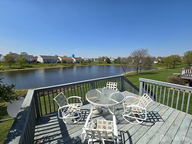 16 Phillip Ct, Monroe, NJ 08831 - wooden deck with a water view, a lawn, and outdoor dining space