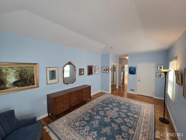16 Phillip Ct, Monroe, NJ 08831 - living room featuring dark wood-style floors, vaulted ceiling, and baseboards