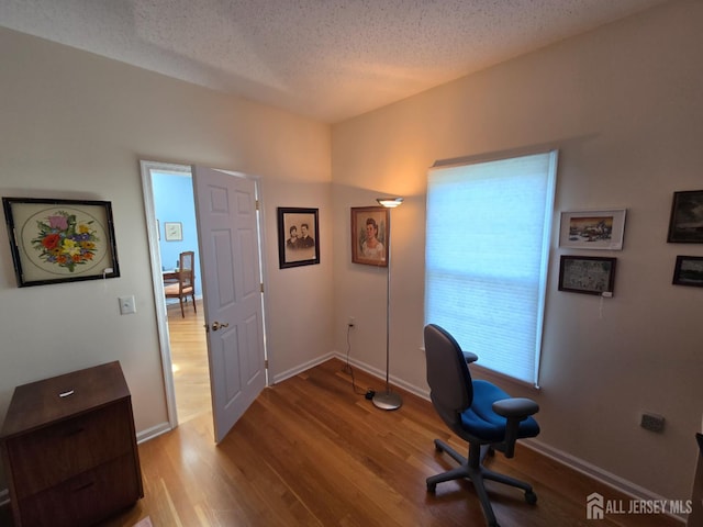 16 Phillip Ct, Monroe, NJ 08831 - office area featuring wood finished floors, a textured ceiling, and baseboards