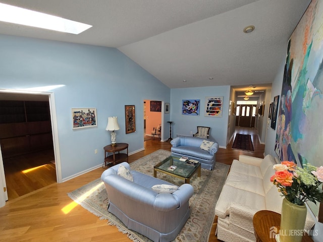 16 Phillip Ct, Monroe, NJ 08831 - living room with lofted ceiling, wood finished floors, a skylight, and baseboards