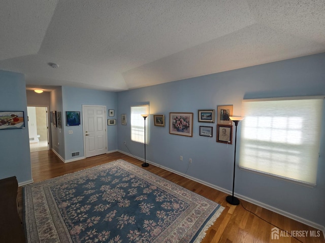 16 Phillip Ct, Monroe, NJ 08831 - entrance foyer with a textured ceiling, wood finished floors, and baseboards