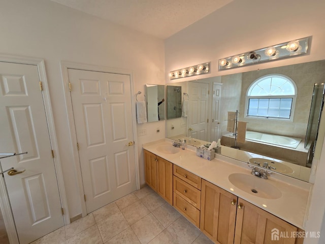16 Phillip Ct, Monroe, NJ 08831 - bathroom featuring double vanity, a garden tub, tile patterned floors, and a tile shower