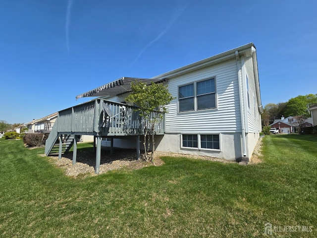 16 Phillip Ct, Monroe, NJ 08831 - rear view of house featuring a wooden deck, a yard, and stairs