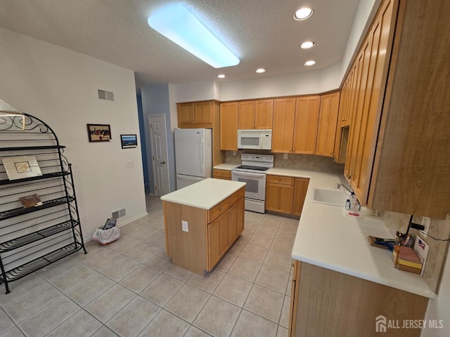 16 Phillip Ct, Monroe, NJ 08831 - kitchen with white appliances, a kitchen island, recessed lighting, light countertops, and a textured ceiling