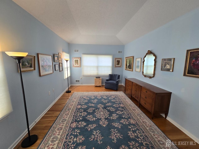 16 Phillip Ct, Monroe, NJ 08831 - living area with wood finished floors, baseboards, and a textured ceiling