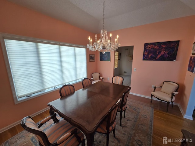 16 Phillip Ct, Monroe, NJ 08831 - dining area featuring a chandelier, wood finished floors, lofted ceiling, and baseboards