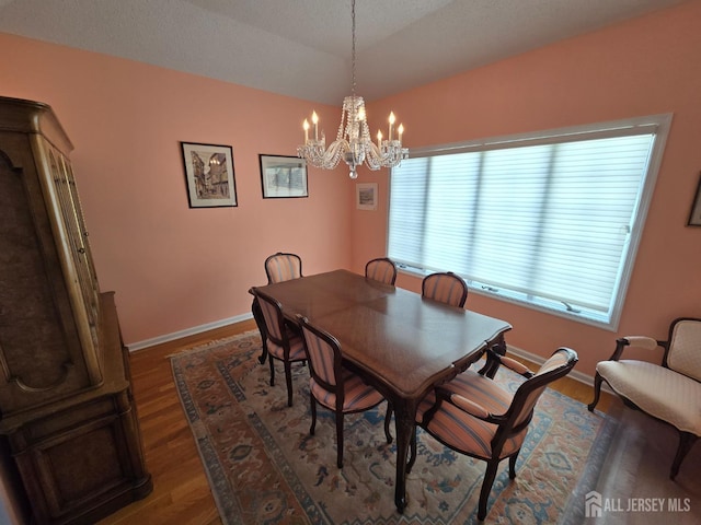 16 Phillip Ct, Monroe, NJ 08831 - dining room featuring a chandelier, wood finished floors, and baseboards