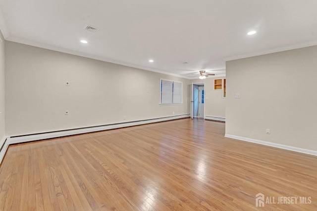 unfurnished room with baseboards, ornamental molding, baseboard heating, and light wood-style floors