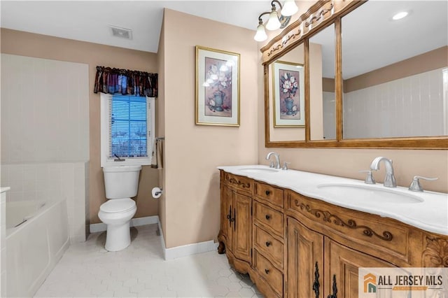 bathroom with toilet, baseboards, visible vents, and a sink