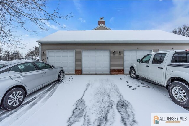 view of snow covered garage