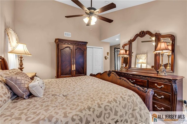 bedroom featuring ceiling fan, a closet, and visible vents