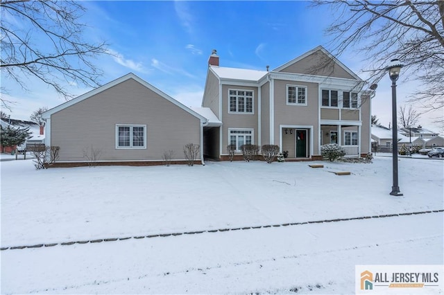 view of snow covered house