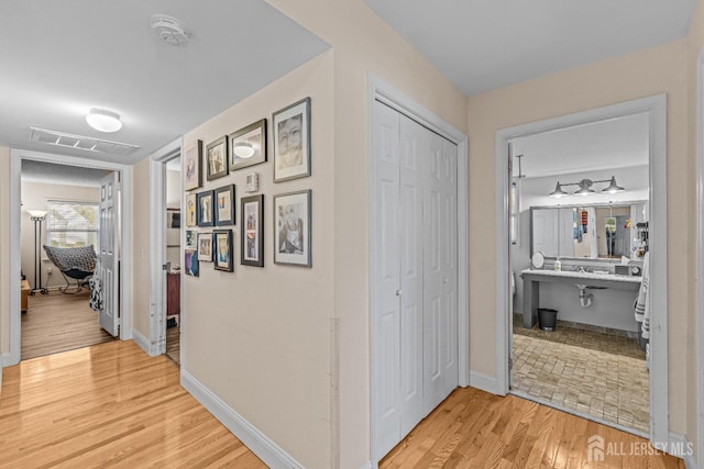 corridor featuring light hardwood / wood-style flooring