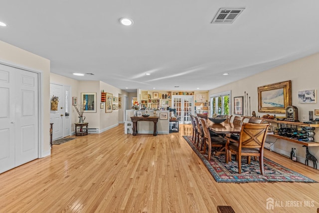 dining room featuring light hardwood / wood-style floors