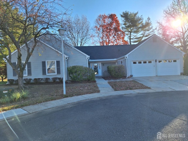 ranch-style house featuring a garage