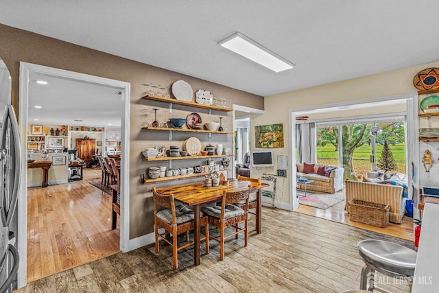 dining area with hardwood / wood-style floors