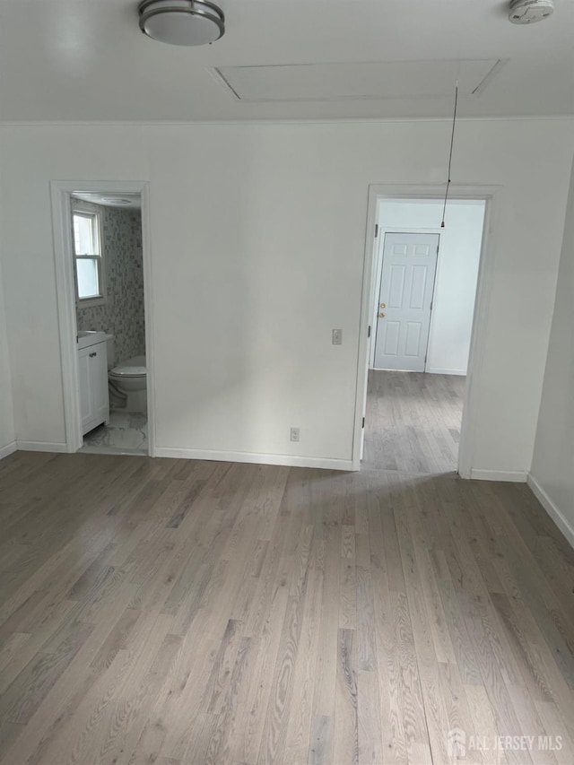 spare room with light wood-type flooring