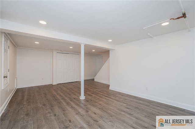 basement featuring hardwood / wood-style floors