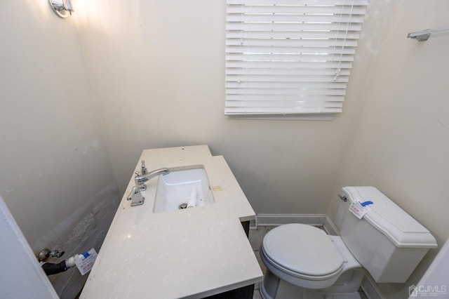bathroom featuring toilet and vanity