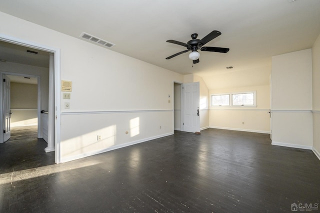 unfurnished room featuring visible vents, a ceiling fan, baseboards, and wood finished floors