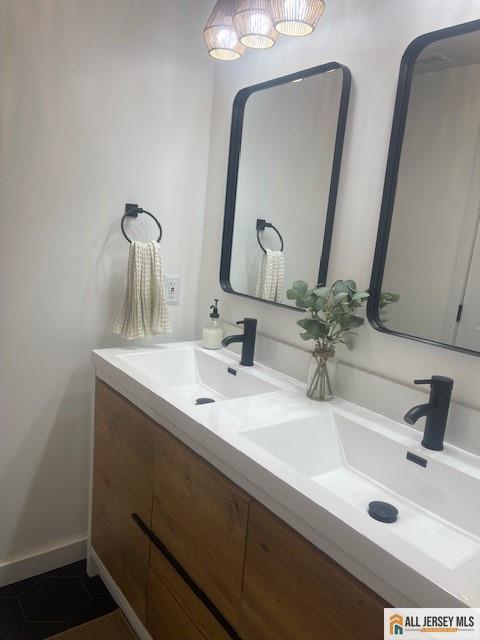 bathroom with double vanity and a sink