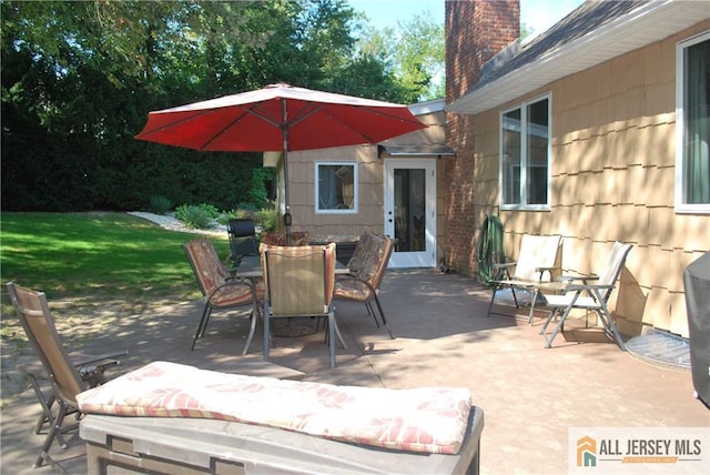 view of patio featuring outdoor dining space