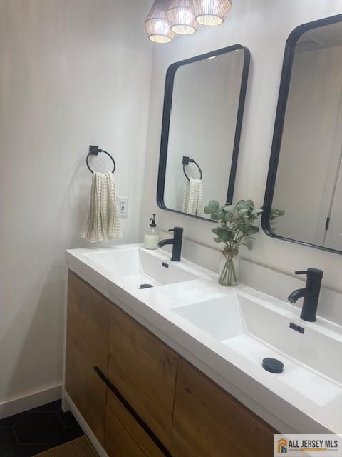 bathroom with double vanity and a sink