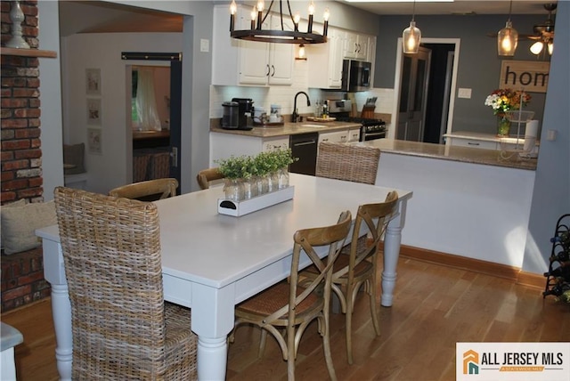 dining room with wood finished floors