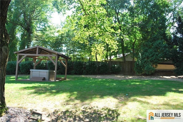 view of yard with a gazebo and fence