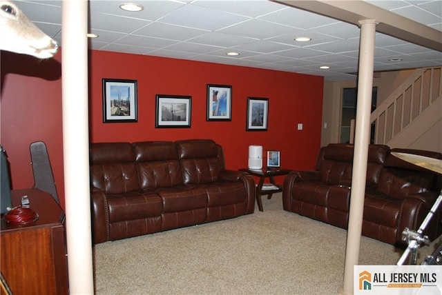 carpeted living room with stairway, recessed lighting, and a paneled ceiling