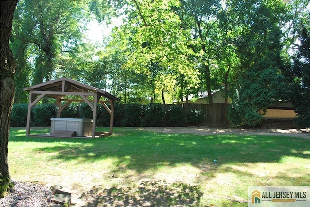 view of yard with a gazebo and fence