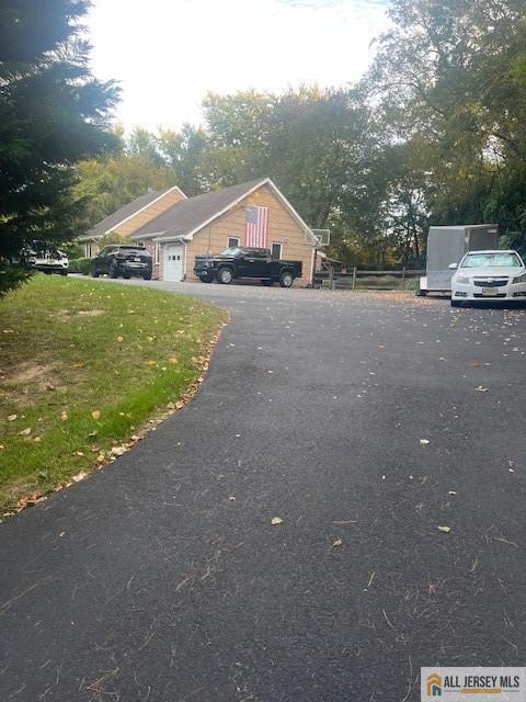 view of front of property with a garage and driveway