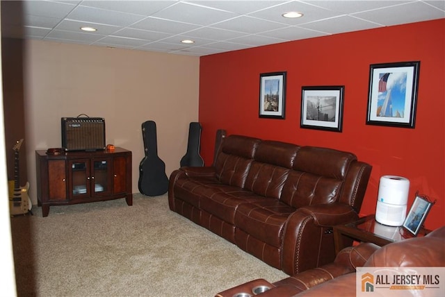 carpeted living room with recessed lighting and a paneled ceiling