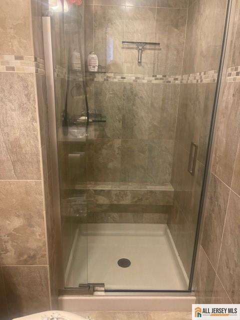 bathroom featuring a stall shower