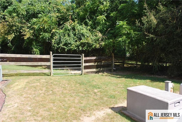 view of yard featuring a gate and fence