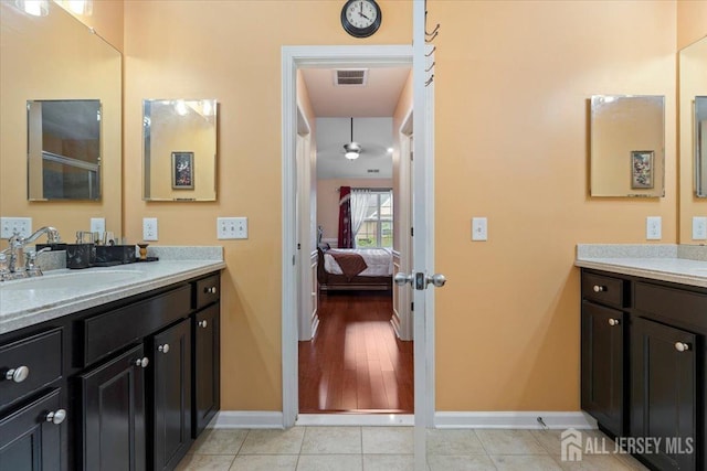 2420 Canterbury Ln, North Brunswick, NJ 08902 - bathroom featuring vanity, baseboards, ensuite bath, and tile patterned flooring