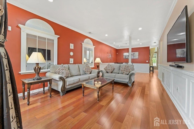 2420 Canterbury Ln, North Brunswick, NJ 08902 - living area featuring light wood-style flooring, a wainscoted wall, recessed lighting, and ornamental molding