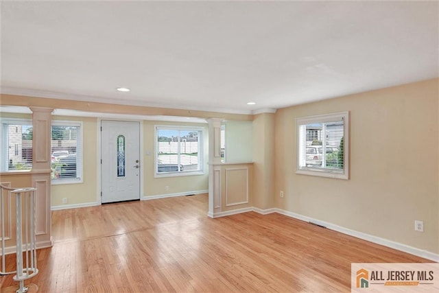 27 Laurel St, South Amboy, NJ 08879 - foyer entrance with decorative columns, light wood-style flooring, recessed lighting, and ornamental molding