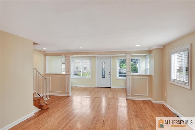 27 Laurel St, South Amboy, NJ 08879 - foyer with decorative columns, light wood-type flooring, and recessed lighting