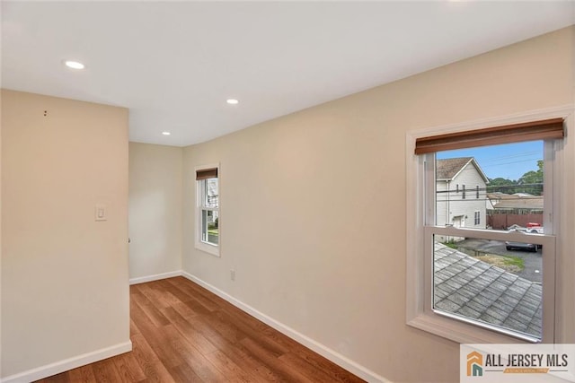 27 Laurel St, South Amboy, NJ 08879 - unfurnished room featuring plenty of natural light, wood finished floors, and recessed lighting