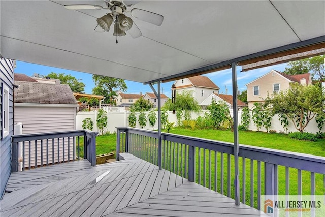 27 Laurel St, South Amboy, NJ 08879 - wooden terrace with a fenced backyard, ceiling fan, and a residential view