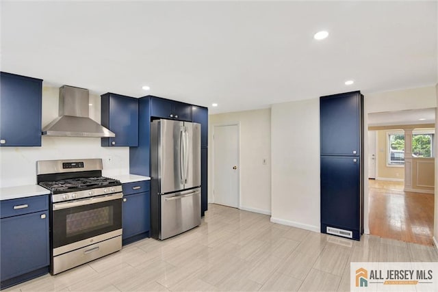 27 Laurel St, South Amboy, NJ 08879 - kitchen featuring wall chimney exhaust hood, stainless steel appliances, blue cabinetry, light countertops, and recessed lighting