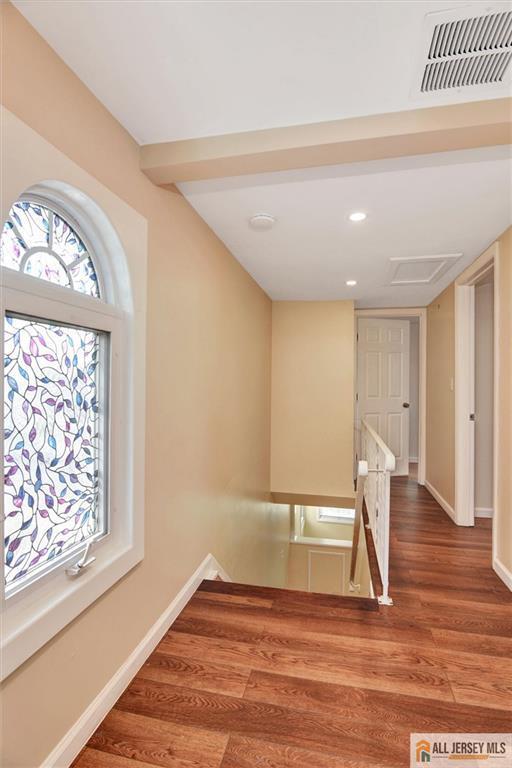 27 Laurel St, South Amboy, NJ 08879 - hall with an upstairs landing, wood finished floors, and recessed lighting