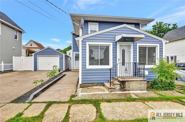 27 Laurel St, South Amboy, NJ 08879 - view of front of home with driveway, an outdoor structure, and a detached garage